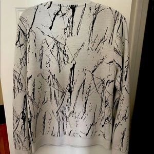 Grey sweater with black stripes